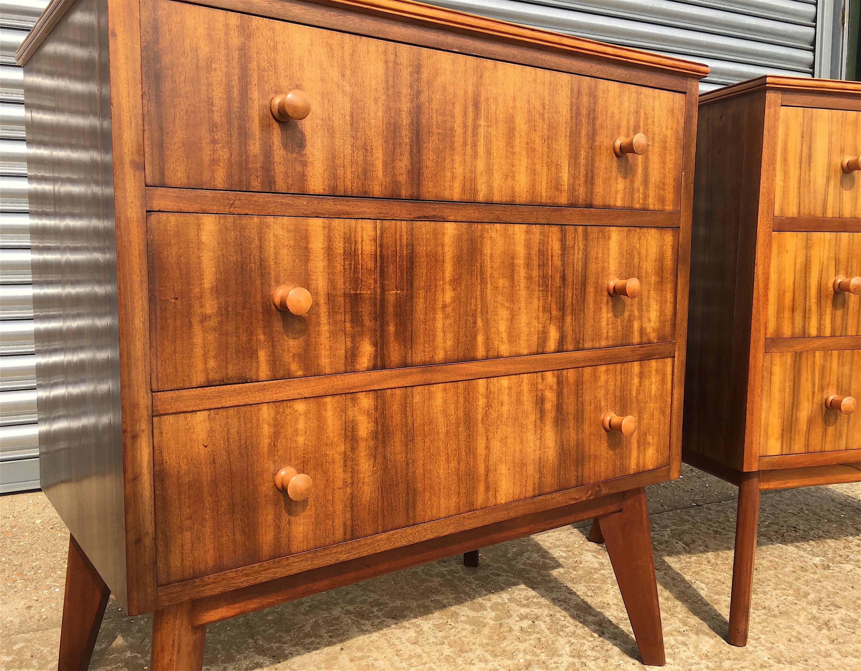 A pair of 1960s Morris Of Glasgow walnut three drawer chests, width 79cm, depth 47cm, height 86cm